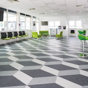 light and dark abstract flooring in a school break area 
