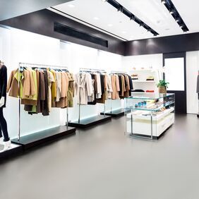 Modern clothing store with grey flooring