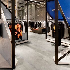 Grey coloured oak effect flooring laid in a clothing store