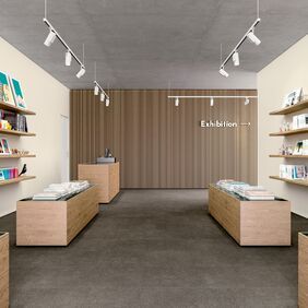 Dark coloured flooring laid in a retail book store