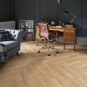 Dark wood study table featuring a Full plank chevron laid flooring in Sienna Oak 