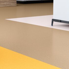 Up close image of yellow and brown flooring