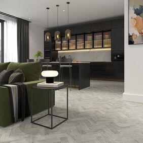 Light grey parquet flooring in a open plan living/ dining area