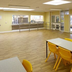 Rustic oak wood effect flooring in a school canteen