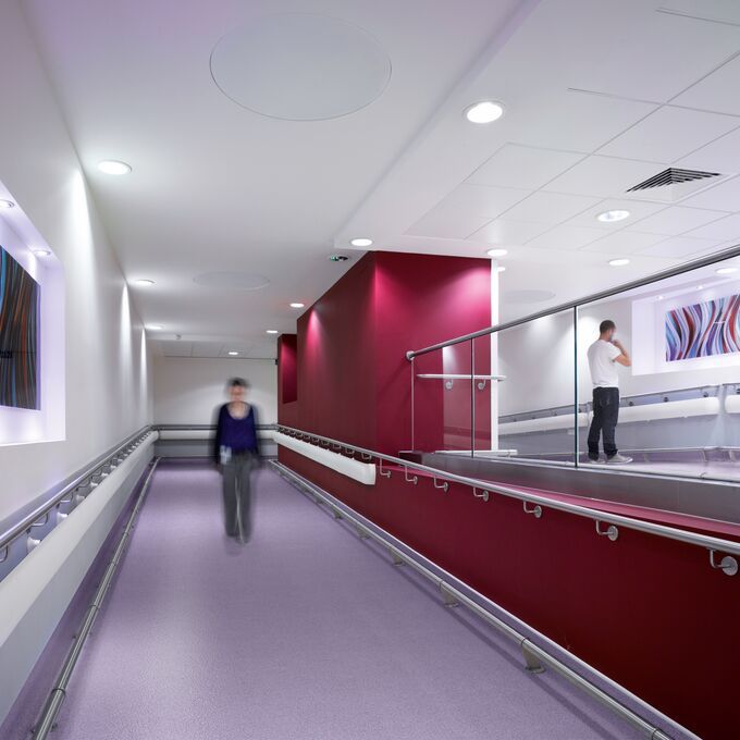 Lilac coloured flooring in a hospital corridor