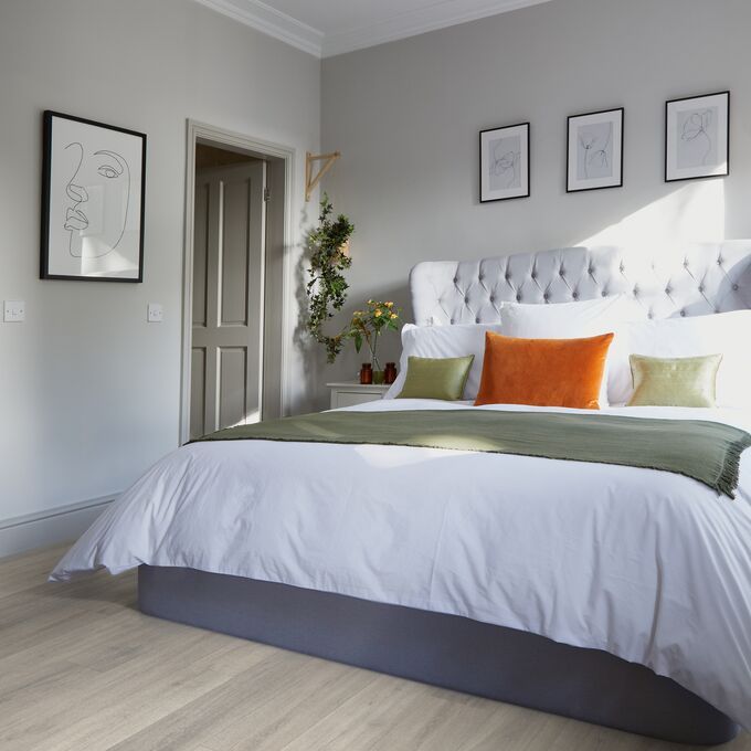 King size bed, pillow, lampshade, pictures, flowers, bedroom 