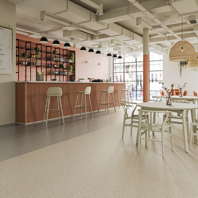 Light coloured safety flooring installed at a commercial bar with seating