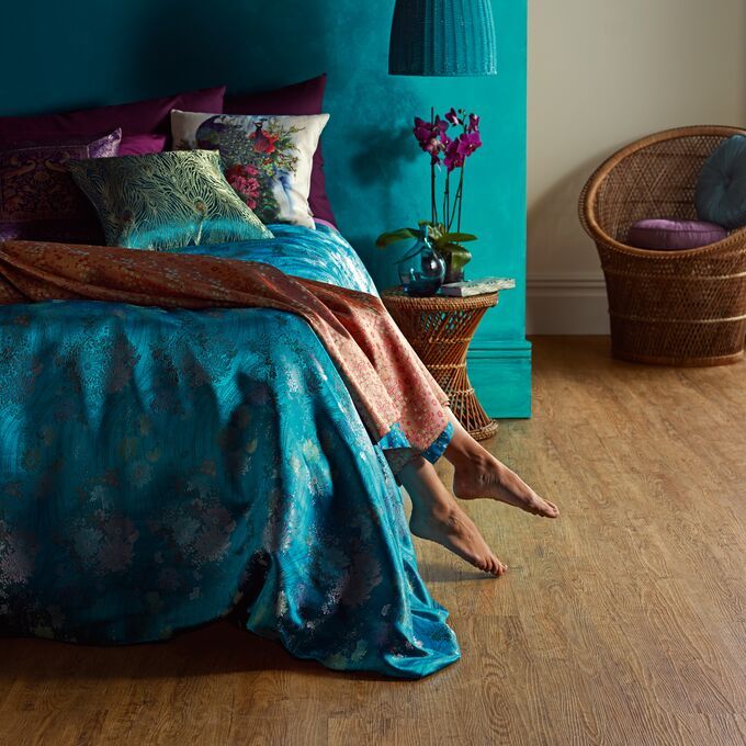 Bedroom featuring a dark wood effect flooring in Wild Amber Oak 