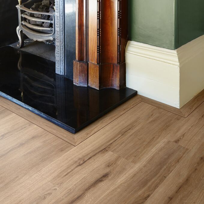 Close up of fireplace surrounded by Natural Oak flooring 