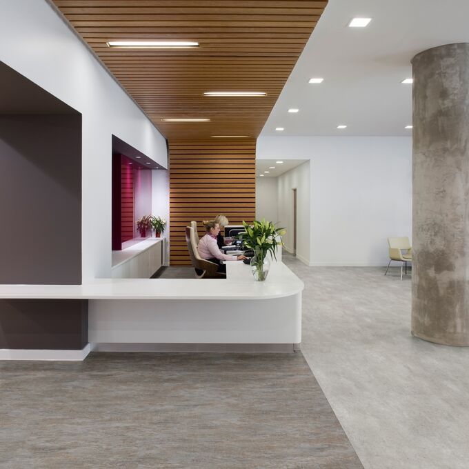 Concrete effect flooring laid in a reception area