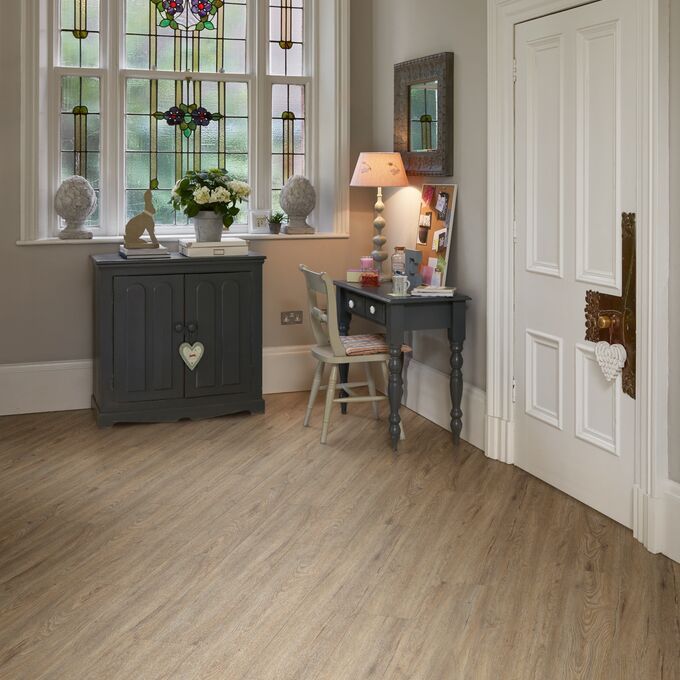 Hallway entrance with dark wood console featuring light wood effect flooring random straight laid in Quayside Oak 