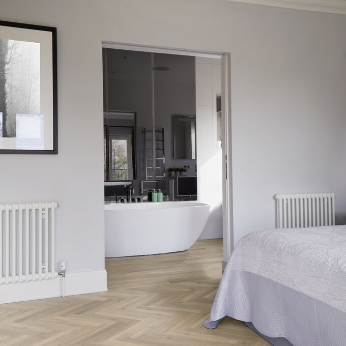 Bedroom, bed, radiator, parquet flooring 