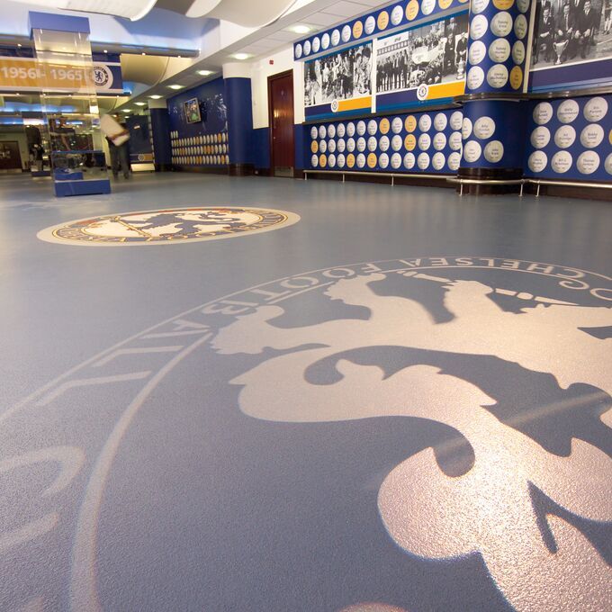 Blue coloured flooring with team logo