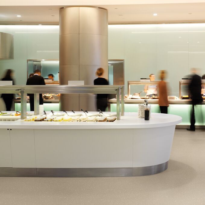 Neutral coloured safety flooring with a decorative chip in a hotel buffet area